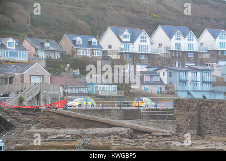 Portreath, Cornwall, UK. 3rd Jan, 2018. UK Weather. In the early hours of the morning huge swell and waves destroyed a 40ft section of the harbour wall at Portreath. The wall divides the car park - which overlooks the sea - from a small beach and the local pub. Police cordoned off the car park. Credit: Simon Maycock/Ģ����ý Live News Stock Photo