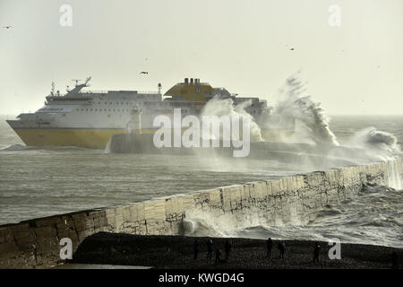 Newhaven, UK. 3rd Jan, 2018. Huge waves in Newhaven, East Sussex, draw spectators as Storm Eleanor brings strong winds to the south coast. Credit: Peter Cripps/Alamy Live News Stock Photo