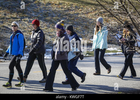 Davenport, Iowa, USA. 1st Jan, 2017. Members of the Quad-Cities Women's Outdoor Club hike together at Crow Creek Park in Milan on Sunday, January 1, 2017. The club holds an annual hike on New Years Day to get members outdoors to start off their year. Credit: Andy Abeyta/Quad-City Times/ZUMA Wire/Alamy Live News Stock Photo