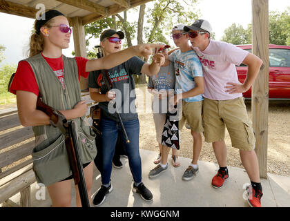 Dewitt, Iowa, USA. 19th June, 2017. Members of the North Scott Trap Shooting team talk about their latest practic rounds, Monday, June 19, 2017, during practice at the Clinton County Sportsmen Club near DeWitt. Credit: John Schultz/Quad-City Times/ZUMA Wire/Alamy Live News Stock Photo