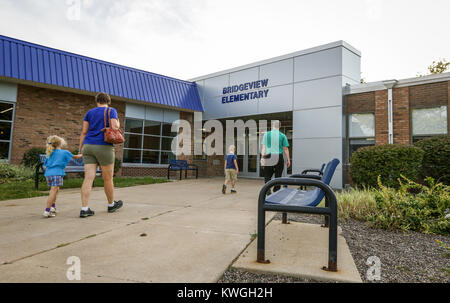 Davenport, Iowa, USA. 14th Sep, 2016. A family is seen walking in the main entrance at Bridgeview Elementary School in Le Claire on Wednesday, September 14, 2016. Bridgeview Elementary in the Pleasant Valley Community School District held an open house after undergoing significant renovation and expansion. Credit: Andy Abeyta/Quad-City Times/ZUMA Wire/Alamy Live News Stock Photo