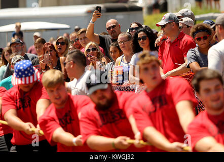 Leclaire, Iowa, USA. 12th Aug, 2017. A male spectator uses his phone to capture the sites, Saturday, August 12, 2017, during the 31st annual Tugfest between LeClaire Iowa and Port Byron Illinois. Credit: John Schultz/Quad-City Times/ZUMA Wire/Alamy Live News Stock Photo