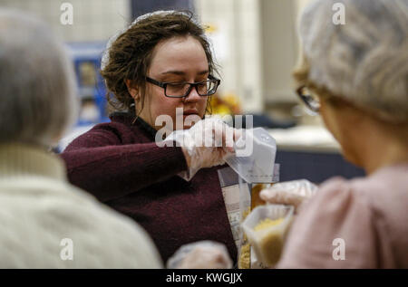 Bettendorf, Iowa, USA. 8th Dec, 2016. First year student Jordan Karben dumps pasta into bags at Scott Community College in Bettendorf on Thursday, December 8, 2016. Faculty, staff, and students worked together in partnership with The Outreach Program to package meals for families to be distributed in the Quad-City area. Credit: Andy Abeyta/Quad-City Times/ZUMA Wire/Ģ����ý Live News Stock Photo