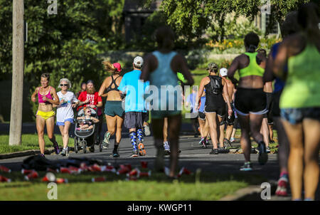 Davenport, Iowa, USA. 13th July, 2017. Runners pass each other near the turnaround on McClellan Boulevard during the Bix at Six training run in Davenport on Thursday, July 13, 2017. The run marks the third and final training run leading up to the Quad-City Times Bix 7 Race on Saturday, July 29. Credit: Andy Abeyta, Quad-City Times/Quad-City Times/ZUMA Wire/Alamy Live News Stock Photo