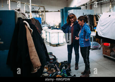 Mytilini, Greece. 8th Feb, 2016. Having their storage inside a working industrial clothes washing facility, things sometimes are moved around the place and need to be sorted out and controlled again.Dirty Girls of Lesbos is a volunteer group born in September 2015 by the idea of Alison Terry-Evans.The volunteer group is almost only women group who takes care of sorting out, washing, and make ready to be reused, the clothes of the hundreds of thousand of migrants who passed through the island. The idea is that instead of buying new clothes or waiting for donations, wet clothes of migran Stock Photo