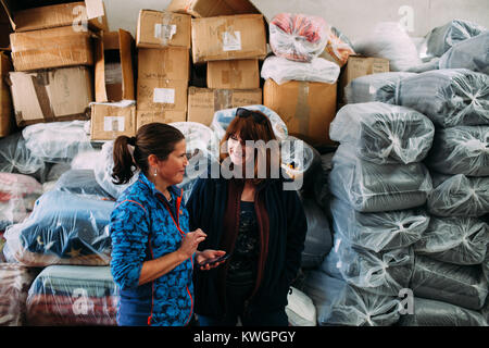 Mytilini, Greece. 8th Feb, 2016. Gittan together with Linda in the laundry warehouse. In the absence of the founder of the group Allison, she ensure the efficiency of the group.Dirty Girls of Lesbos is a volunteer group born in September 2015 by the idea of Alison Terry-Evans.The volunteer group is almost only women group who takes care of sorting out, washing, and make ready to be reused, the clothes of the hundreds of thousand of migrants who passed through the island. The idea is that instead of buying new clothes or waiting for donations, wet clothes of migrants arriving with boats Stock Photo