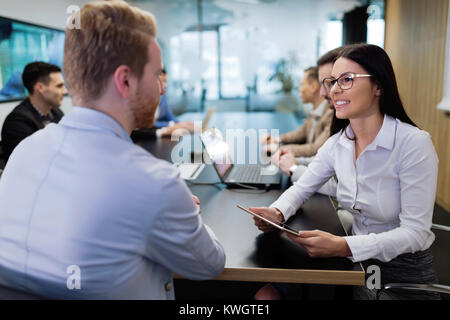 Portrait of business couple in conference room Stock Photo