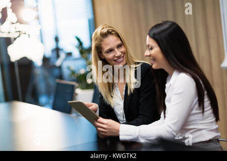 Two businesswomen having discussion in conference room Stock Photo
