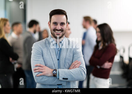 Portrait of young businessman posing in office Stock Photo