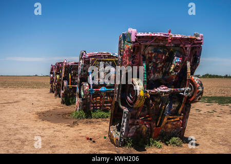 Famous Cadillac Ranch, public art and sculpture installation created by Chip Lord, Hudson Marquez and Doug Michels near Amarillo, Texas, USA. Stock Photo