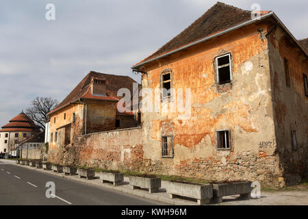 An old building in the riverside Lent district of Maribor, Slovenia. The building's brickwork is exposed. Stock Photo