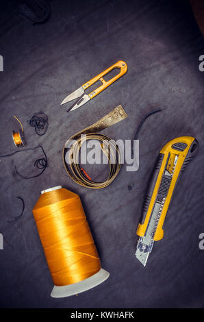 yellow coil centimeter Sewing Tools on Black Background Stock Photo