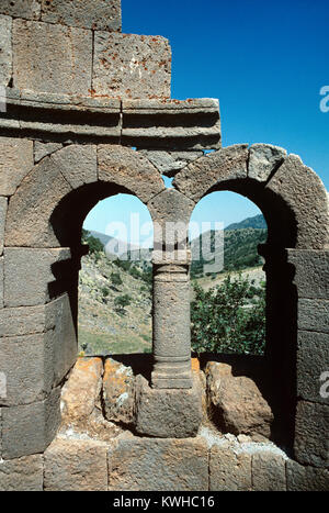 View through Double Stone Clerestory Windows of Ruined Byzantine Church at Binbirkilise or Binbir Kilise, literally The Thousand an One Churches, a region of antique Lycaonia, around the village of Madensehri, in Karaman Province, Turkey, known for around Fifty Ruined Byzantine Churches. The region was an important centre for Byzantine Christians between the c3rd and c8th. Stock Photo