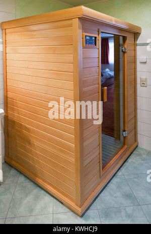 small wooden modern infrared sauna Stock Photo