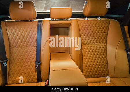 leather interior of a luxury modern car closeup. back passengers seats. Stock Photo