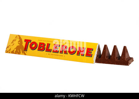 A bar of Toblerone swiss milk chocolate with honey & almond nougat on a white background Stock Photo