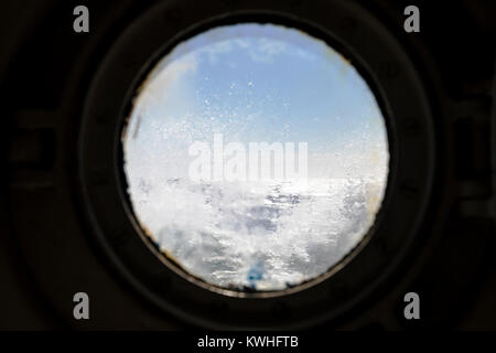 Ocean Adventurer ship port hole view of rough Drake Passage; Pasaje de Drake; Mar de Hoces; Sea of Hoces; ocean between South America & Antarctica Stock Photo