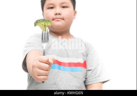 broccoli on hand obese fat boy isolated on white background, healthy food concept and copy space Stock Photo