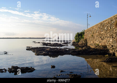 View from the beach of the Stintino jetty in Sardinia at dawn Stock Photo