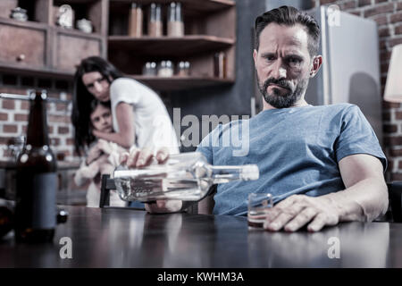 Cheerless melancholic man thinking about his life Stock Photo