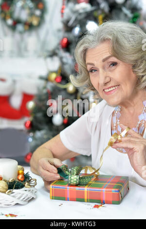 Portrait of senior woman preparing for Christmas Stock Photo