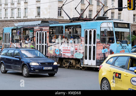 Sofia, Bulgaria - July 04, 2017: Typical Eastern Europe tram downtown Sofia, Bulgaria. The Tram network comprises of 15 urban lines. Stock Photo