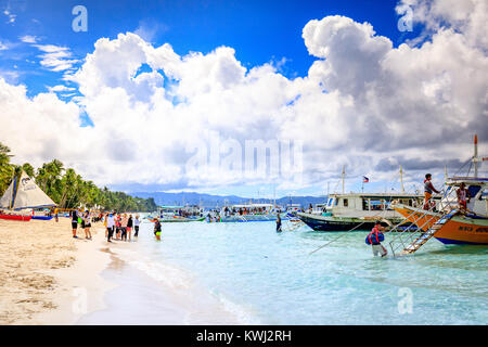 BORACAY ISLAND, PHILIPPINES - November 18, 2017 : Traditional Sailboats on Crowded Boracay beach Stock Photo