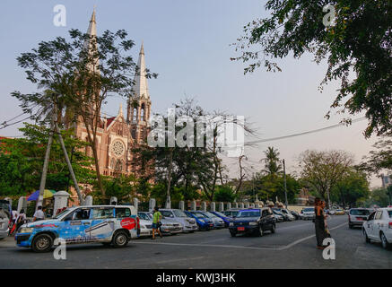 Yangon, Myanmar - Feb 26, 2016. Cars run on street at downtown in Yangon, Myanmar. Yangon is Myanmar largest city and its most important commercial ce Stock Photo