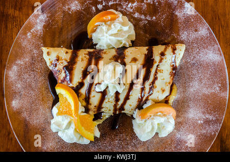 Boom boom banana - Crêpe with vanilla ice cream, chocolate cream & banana sauce. Stock Photo