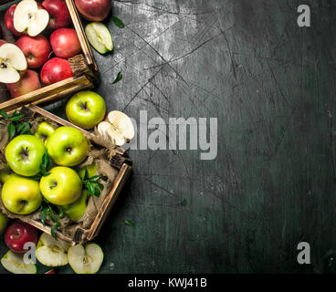 Juicy apples in wooden boxes isolated on white Stock Photo - Alamy