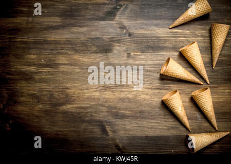 Waffle cups for ice cream. On a wooden table. Stock Photo