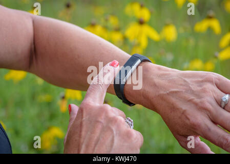 closeup of woman using smartwatch activity tracker Stock Photo