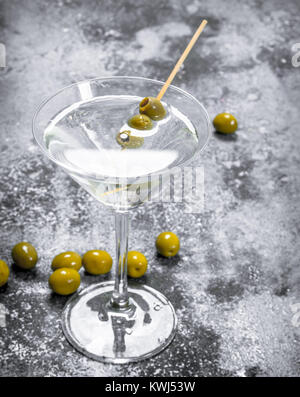 Martini with olives. On a rustic background. Stock Photo