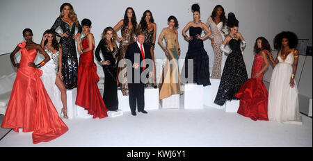 NEW YORK, NY - JULY 27: Donald Trump and Miss Universe Organization President Paula Shugart (C) and (L-R) Miss Tanzania 2007 Flaviana Matata, Miss Albania 2010 Angela Martini, Miss Ireland 2010 Rosanna Purcell, Miss USA 2003 Susie Castillo, Miss USA 2004 Shandi Finnessey, Miss Universe 2003 Amelia Vega, Miss Universe 2008 Dayanna Mendoza, Miss Universe 2002 Justine Pasek, Miss Universe 2007 Riyo Mori, Miss Kosovo 2009 Marigona Dragusha, Miss Kosovo 2008 Zana Krasniqi, and Miss France 2009 Chloe Mortaud attend a photocall at Chelsea Piers, Studio 59 on July 27, 2011 in New York City.  People:   Stock Photo