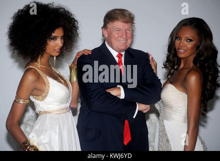 NEW YORK, NY - JULY 27: Donald Trump and Miss Universe Organization President Paula Shugart (C) and (L-R) Miss Tanzania 2007 Flaviana Matata, Miss Albania 2010 Angela Martini, Miss Ireland 2010 Rosanna Purcell, Miss USA 2003 Susie Castillo, Miss USA 2004 Shandi Finnessey, Miss Universe 2003 Amelia Vega, Miss Universe 2008 Dayanna Mendoza, Miss Universe 2002 Justine Pasek, Miss Universe 2007 Riyo Mori, Miss Kosovo 2009 Marigona Dragusha, Miss Kosovo 2008 Zana Krasniqi, and Miss France 2009 Chloe Mortaud attend a photocall at Chelsea Piers, Studio 59 on July 27, 2011 in New York City.  People:   Stock Photo