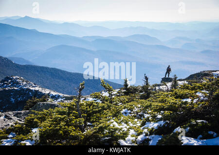 Lone hiker takes in the view south from Mt. Mansfield, highest point in Vermont, USA, New England, Stowe, VT, Green Mountains. Stock Photo