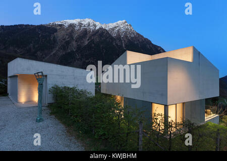 Architecture, entrance of a modern house, evening in mountain Stock Photo