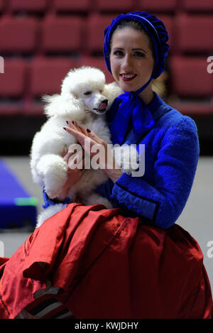 Victoria Akimova as Gerda with trained dog during the press conference dedicated to the premiere of the circus show Snow Queen in St. Petersburg Stock Photo