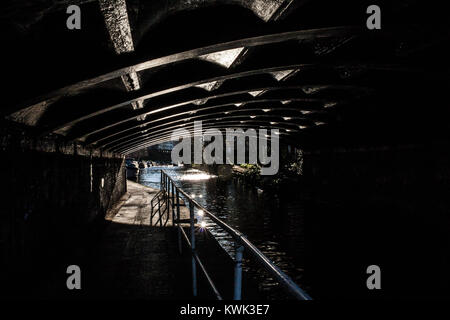 Under the bridge. I'm always been attracted to this sort of light and its reflections. This is one of the few of the catalog. Stock Photo