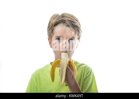Portrait of a boy eating banana Stock Photo