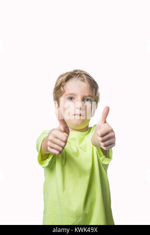 Little boy showing two thumbs up on white background Stock Photo