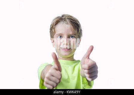 Little boy showing two thumbs up on white background Stock Photo