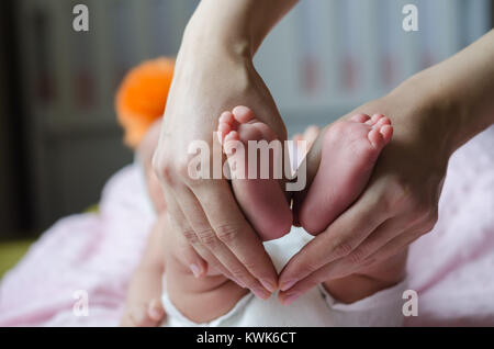 Baby feet in mother hands.baby is sleeping