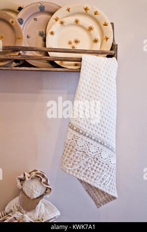 Dishes for lunch and kitchen towels in warm and cozy color for your home Stock Photo