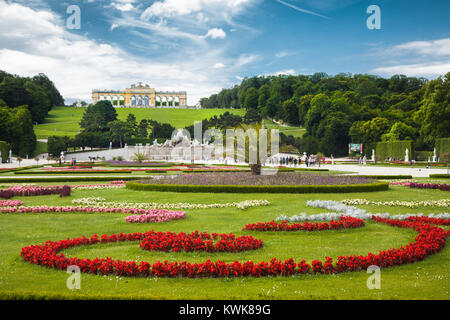 Classic view of scenic Great Parterre garden with Gloriette on a hill at famous Schonbrunn Palace on a beautiful sunny day in summer, Vienna, Austria Stock Photo