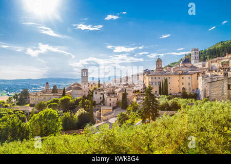 Panoramic view of the historic town of Assisi on a beautiful sunny day with blue sky and clouds in summer, Umbria, Italy Stock Photo