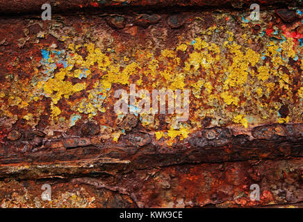 strong colours and interesting patterns of rust on a metallic wreck of a ship near the Wyre estuary in Fleetwood Stock Photo