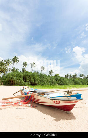 Asia - Sri Lanka - Ahungalla - A fishing boat in front of palm trees