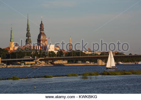 A view of Riga across the Daugava river on a beautiful summer's evening at the peak of the tiourist season Stock Photo