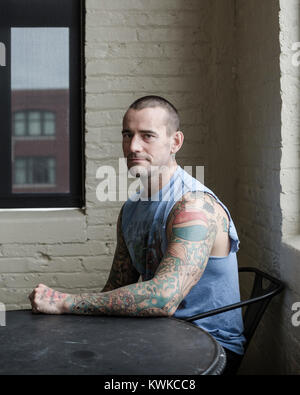 A portrait of CM Punk, former WWE wrestler, photographed in his apartment. Stock Photo